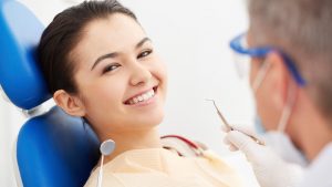 women seeing a dentist at the dental practice - Scale and Polish
