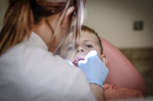 emergency dentist working on a patients teeth