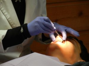 emergency dentist in woodford working on a patient