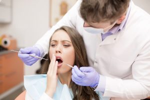 a woman getting emergency dental treatment
