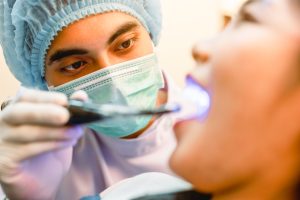 Dental Hygienist checking patient
